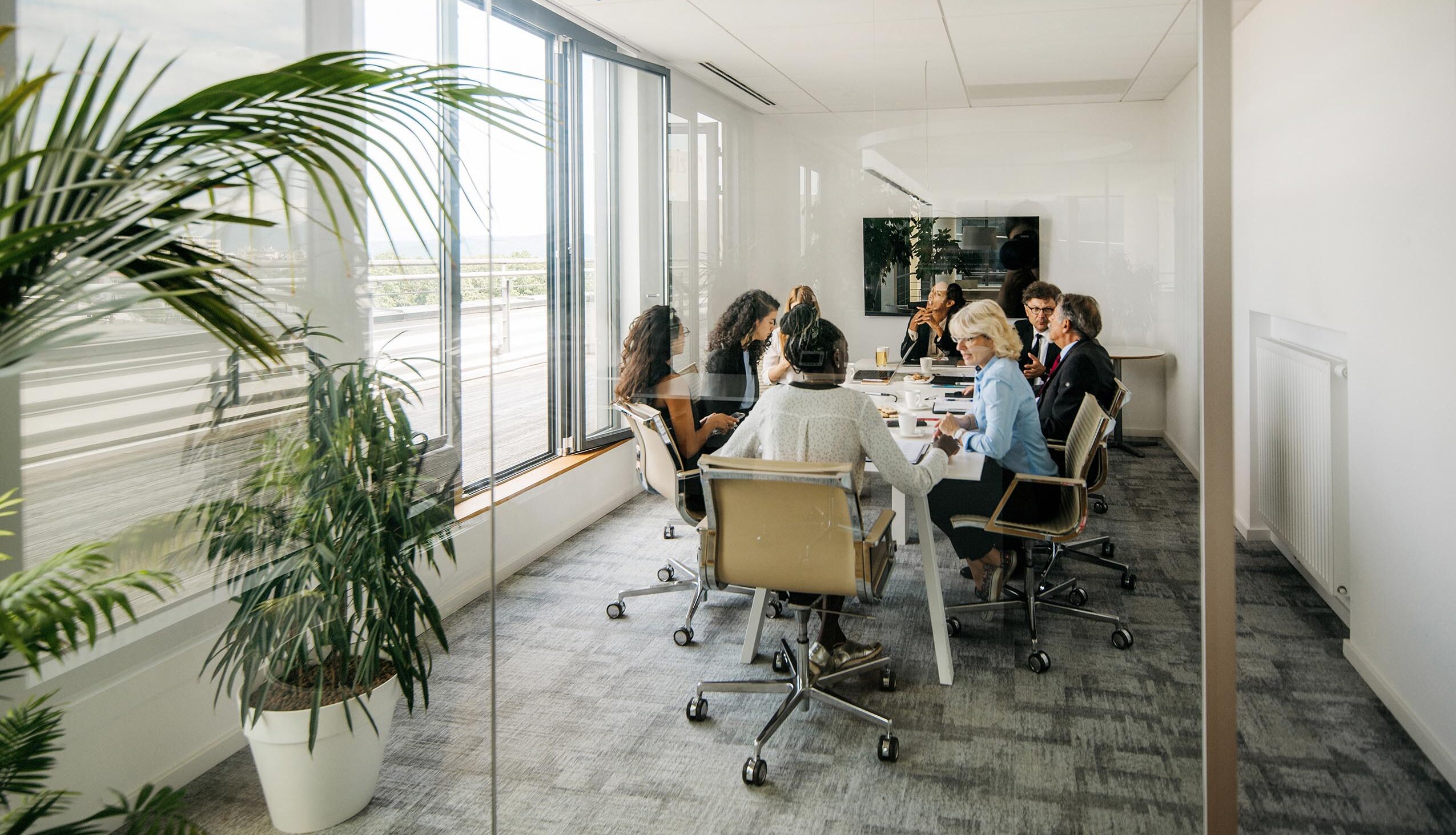 Board of Trustees sitting around a conference table